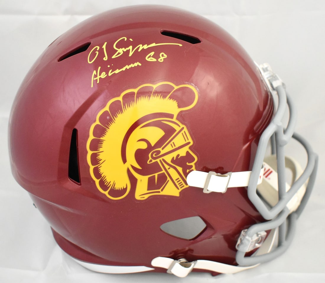 Full Size USC Trojans Speed Helmet Signed by O.J. Simpson Beckett Hologram: Full Size USC Trojans Speed Helmet Signed by O.J. Simpson Beckett Hologram This full-size USC Trojans Speed helmet features the autograph of O.J. Simpson along with a Heisman inscription. The helmet i