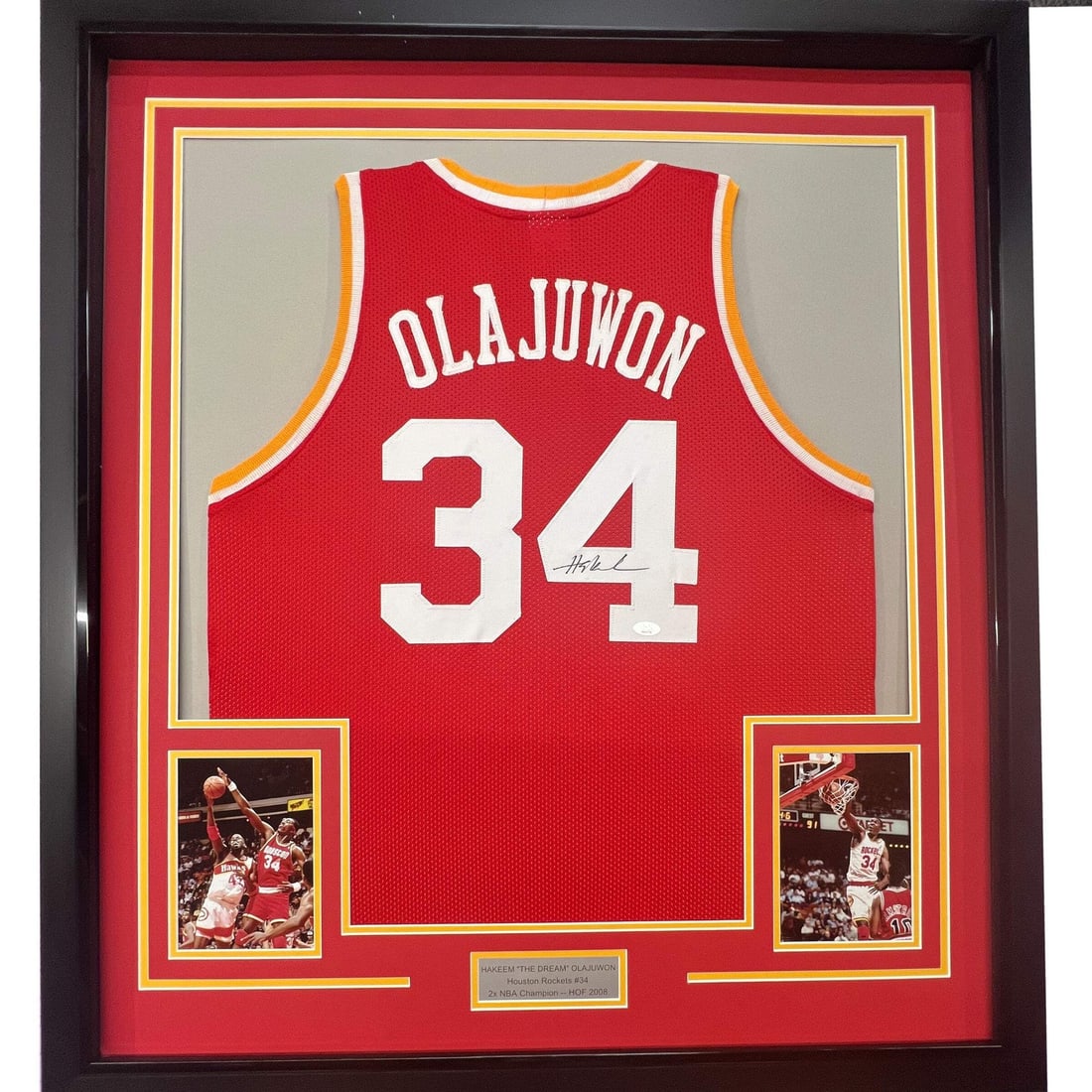 Framed Hakeem Olajuwon Autographed Jersey with BAS COA 33x42 Houston Rockets: Framed Hakeem Olajuwon Autographed Jersey with BAS COA 33x42 Houston Rockets Celebrate the legacy of Hakeem Olajuwon with this stunning framed autographed Houston Rockets jersey. This original item fe