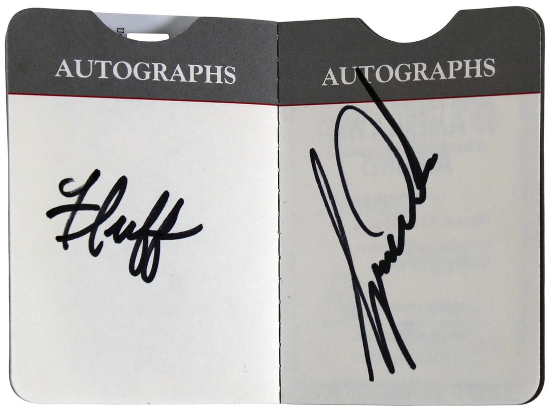 PSA Certified Phoenix Open autograph book signed by Tiger Woods and Fluff Cowan: PSA Certified Phoenix Open autograph book signed by Tiger Woods and Fluff Cowan This Phoenix Open autograph book has been personally signed by Tiger Woods and Mike "Fluff" Cowan. The signatures have b