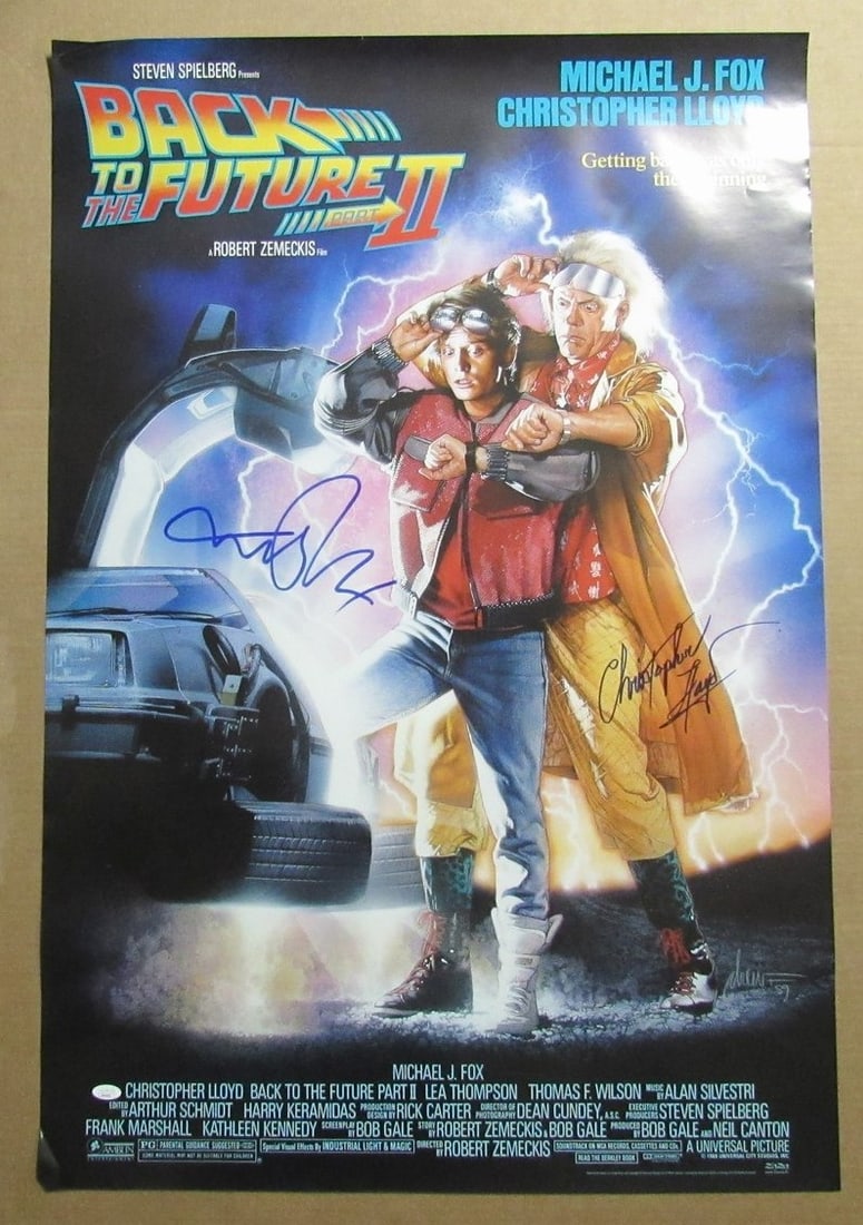 Michael J Fox Christopher Lloyd Autographed 27x40 Back to the Future II Poster JSA: Michael J Fox Christopher Lloyd Autographed 27x40 Back to the Future II Poster JSA This is an original autographed poster of "Back to the Future II" featuring the signatures of Michael J. Fox and Chri