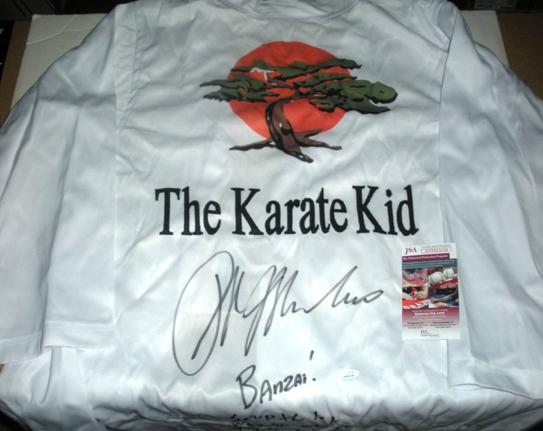 Ralph Macchio Signed Karate Gi With JSA COA Sweep the Leg Banzai Quote: Ralph Macchio Signed Karate Gi With JSA COA Sweep the Leg Banzai Quote This is an original karate gi signed by Ralph Macchio, the actor known for his role in The Karate Kid. The item comes with a JSA/