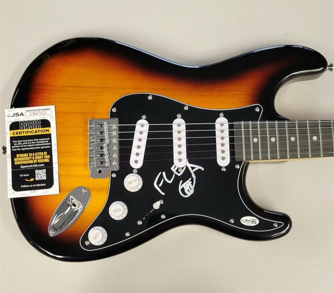 Autographed Full Size Guitar by Flea with JSA Authentication: Autographed Full Size Guitar by Flea with JSA Authentication This is a full size electric guitar autographed by Flea of the Red Hot Chili Peppers. The authenticity of the signature is verified by Jame
