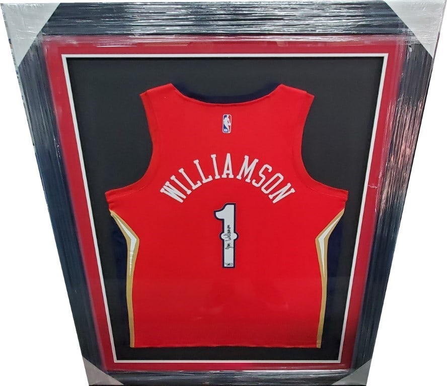 Zion Williamson Signed Framed NBA Jersey Pelicans Fanatics Authentic: Zion Williamson Signed Framed NBA Jersey Pelicans Fanatics Authentic Celebrate Zion Williamson's incredible talent with this hand-signed, framed NBA jersey. This original item features the New Orleans