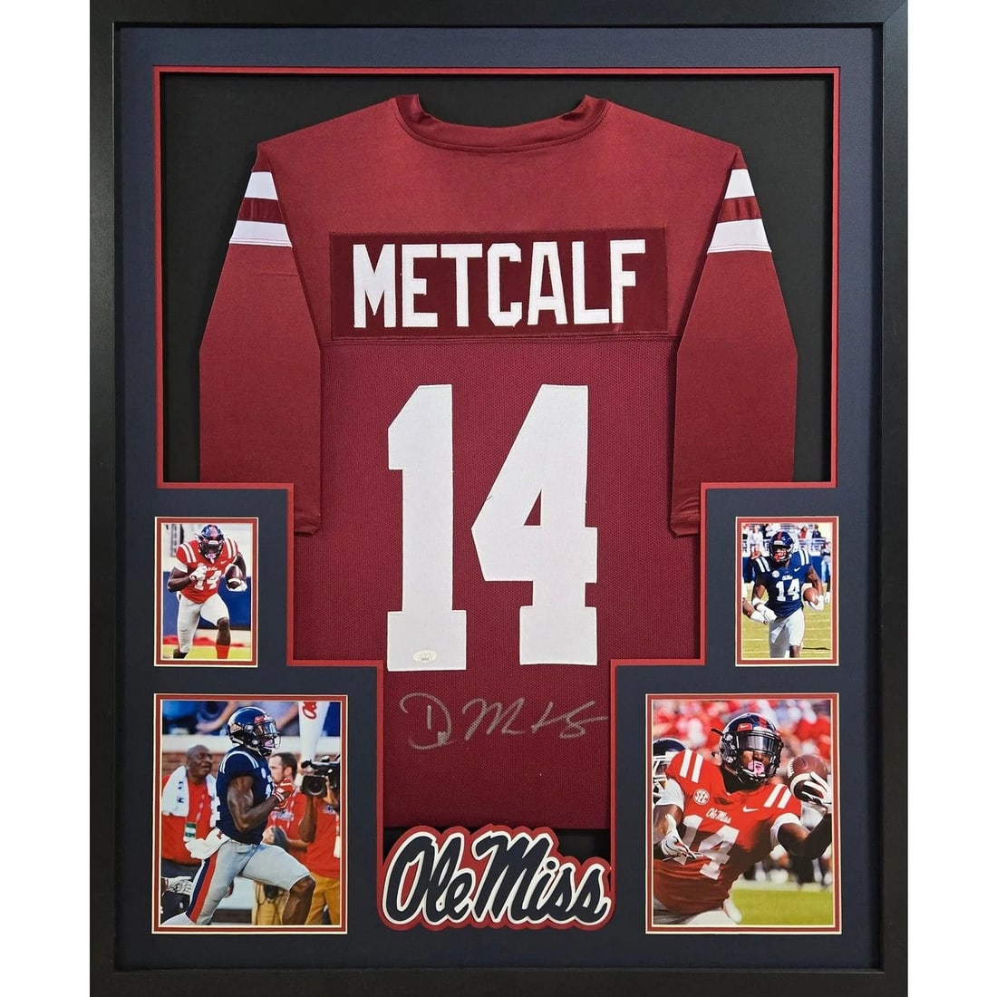 Framed DK Metcalf Autographed Ole Miss Jersey JSA COA 42x34: Framed DK Metcalf Autographed Ole Miss Jersey JSA COA 42x34 This is a framed DK Metcalf Ole Miss jersey, autographed and authenticated by JSA. The display features detailed framing and the Ole Miss lo