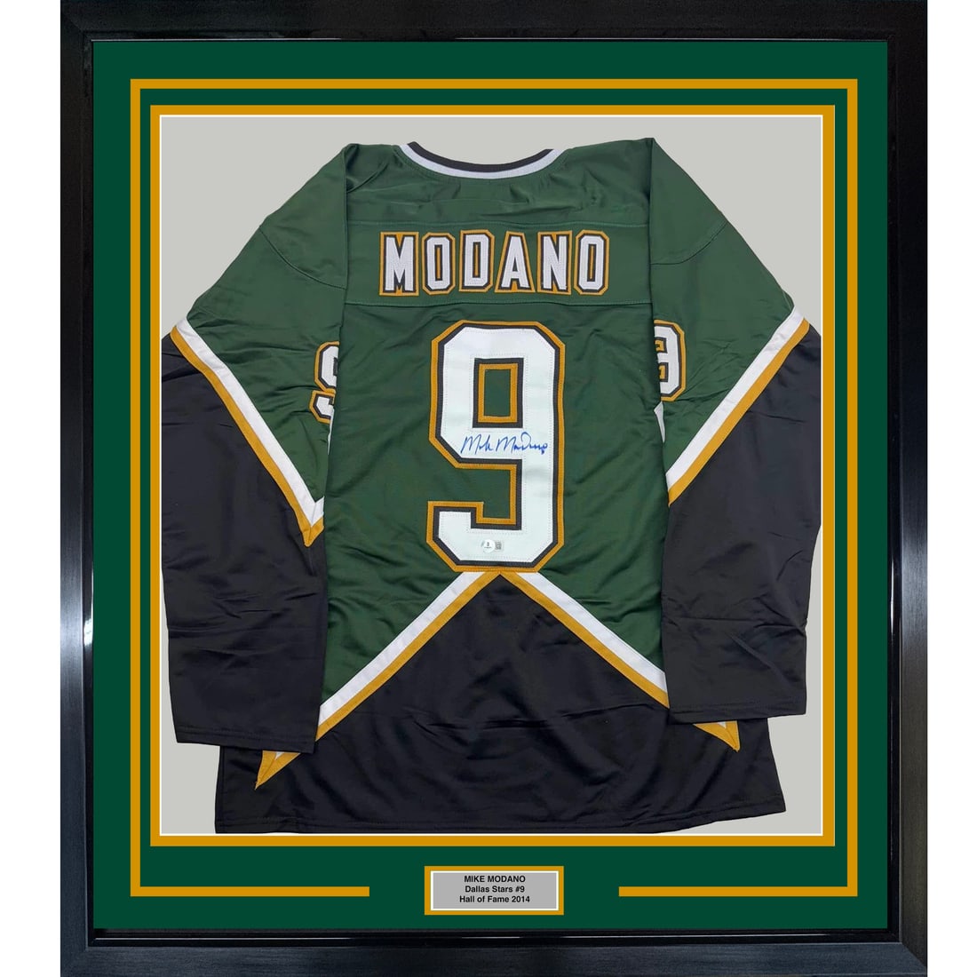 Mike Modano signed Dallas Stars framed jersey BAS COA 33x42: Mike Modano signed Dallas Stars framed jersey BAS COA 33x42 This is a professionally framed and matted Dallas Stars green jersey, autographed by Mike Modano, commemorating the 1999 Cup. The display in