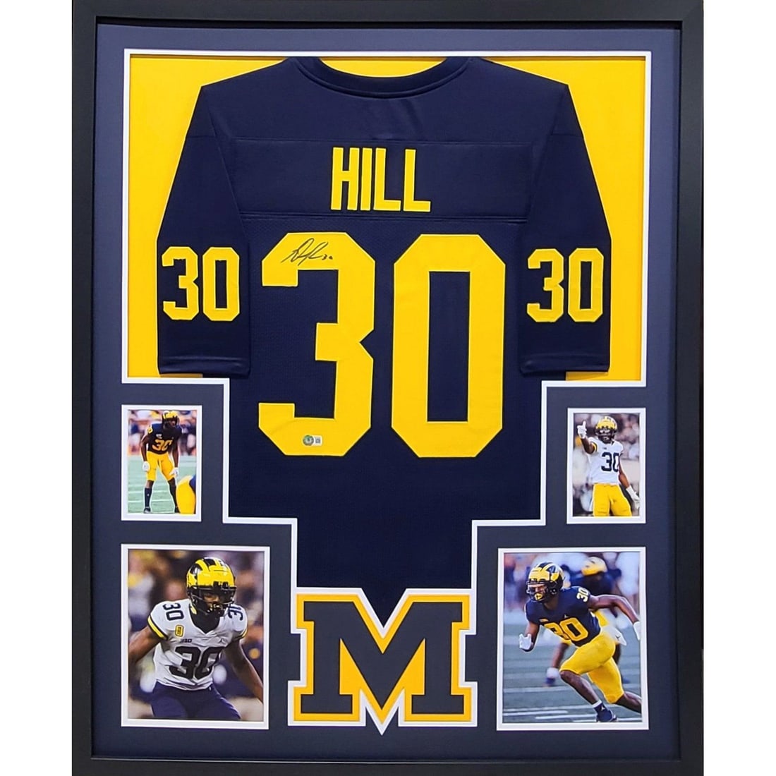 Framed Michigan Jersey Signed by Daxton Hill with Beckett Authentication: Framed Michigan Jersey Signed by Daxton Hill with Beckett Authentication This framed Michigan football jersey is autographed by Daxton Hill and comes authenticated by Beckett, featuring a tamper-proof