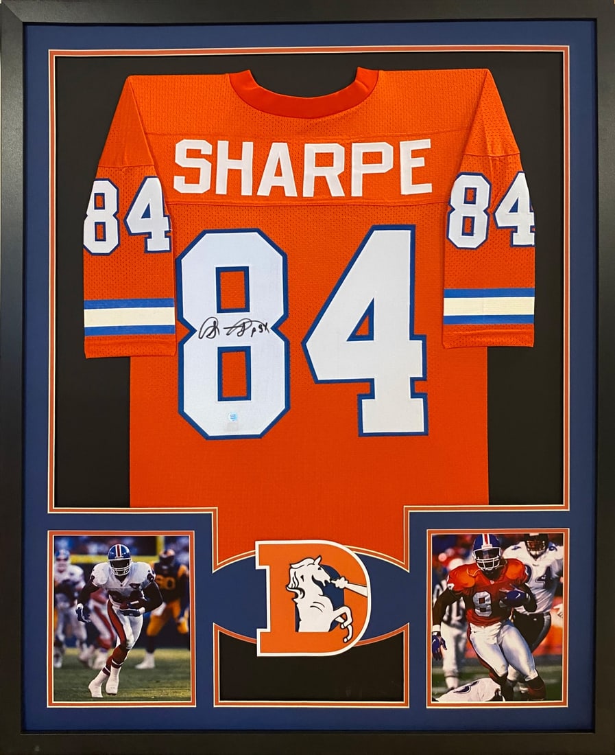 Shannon Sharpe Autographed Framed Jersey GTSM Denver Broncos: Shannon Sharpe Autographed Framed Jersey GTSM Denver Broncos Celebrate the legacy of Shannon Sharpe with this autographed framed jersey from the Denver Broncos. This stunning piece features meticulous