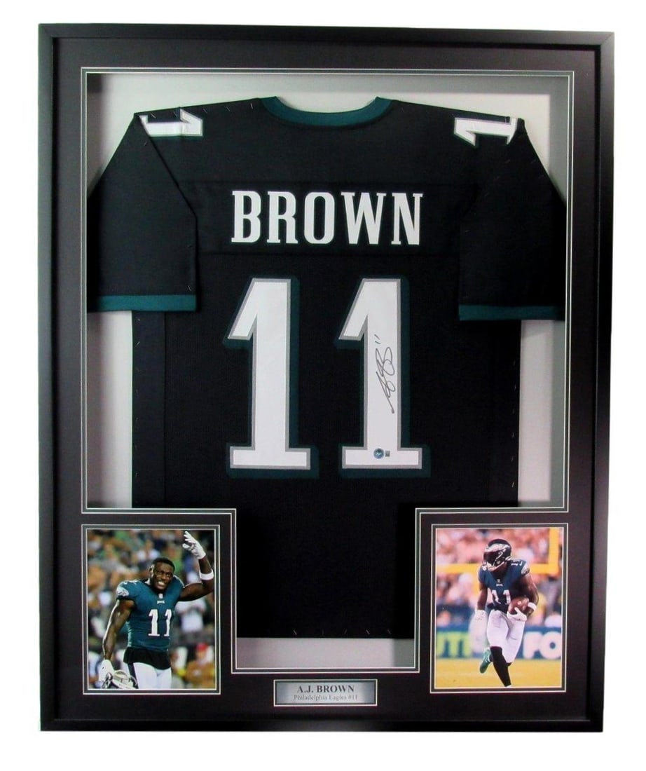 Framed A.J. Brown Signed Eagles Jersey With Photos Beckett Authenticated: Framed A.J. Brown Signed Eagles Jersey With Photos Beckett Authenticated Celebrate your Philadelphia Eagles pride with this A.J. Brown Autographed Black Custom Football Jersey. The jersey is beautiful