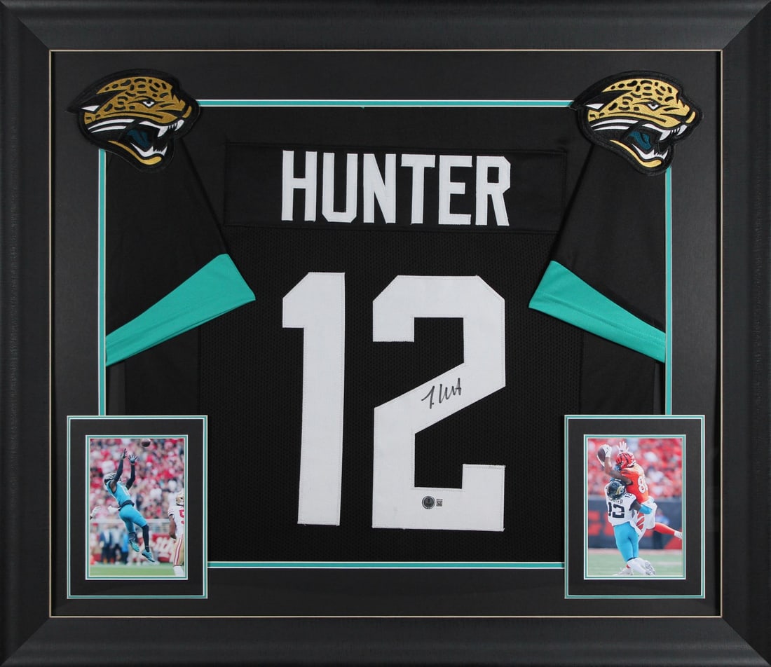 Travis Hunter Signed Black Framed Jersey Jacksonville Jaguars BAS Witnessed: Travis Hunter Signed Black Framed Jersey Jacksonville Jaguars BAS Witnessed This authentic signed black pro style framed jersey showcases the signature of Travis Hunter, an emerging star of the Jackso