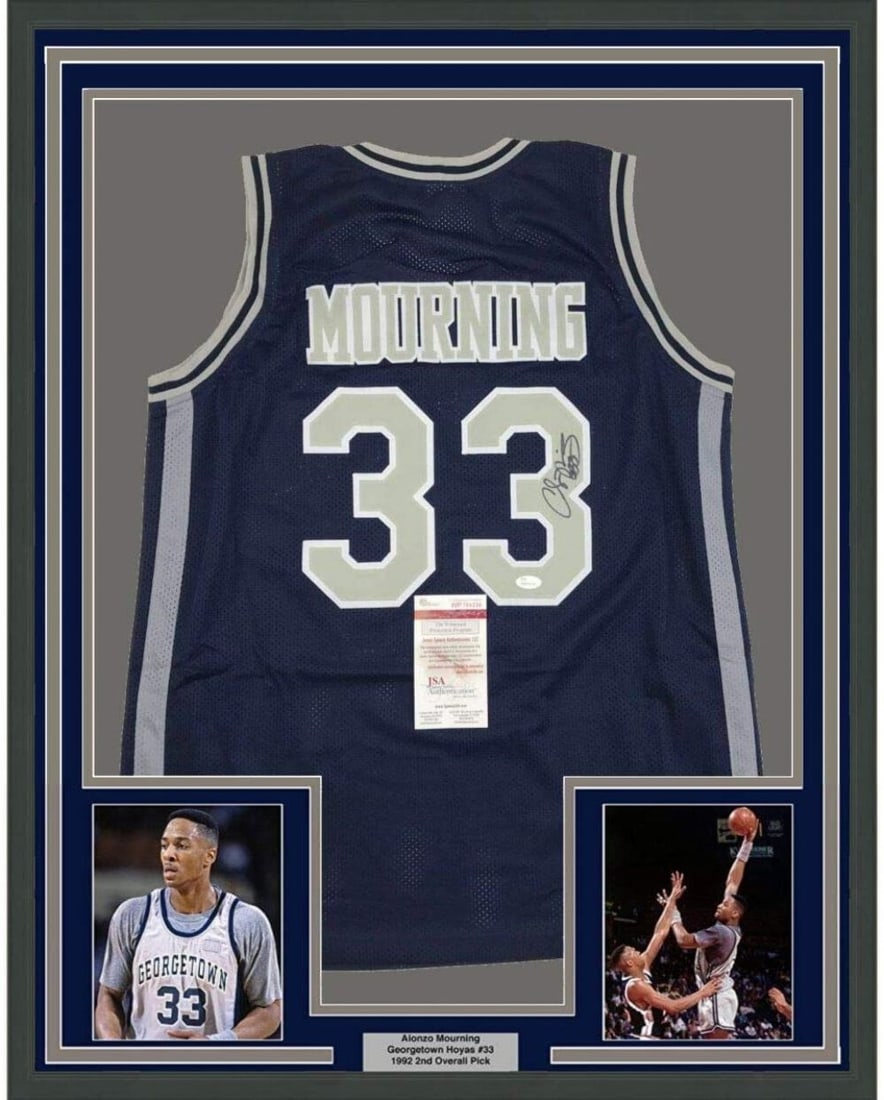 Framed Alonzo Mourning Signed Georgetown Jersey with JSA COA: Framed Alonzo Mourning Signed Georgetown Jersey with JSA COA This professionally framed and matted display features an autographed Alonzo Mourning Georgetown Hoyas blue jersey, accompanied by two 5x7 