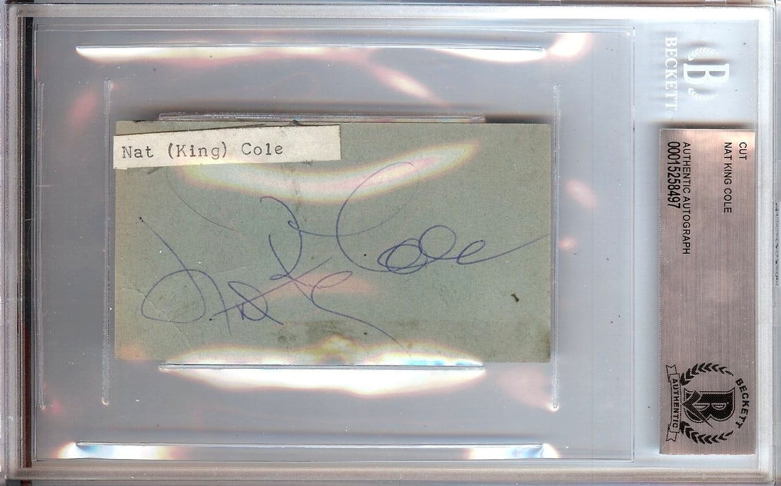 Nat King Cole Autographed Small Cut Signature Beckett Authenticated 4.5 X 7.25: Nat King Cole Autographed Small Cut Signature Beckett Authenticated 4.5 X 7.25 This is a small cut autograph of the legendary singer Nat King Cole, authenticated by Beckett Authentication Services (BA
