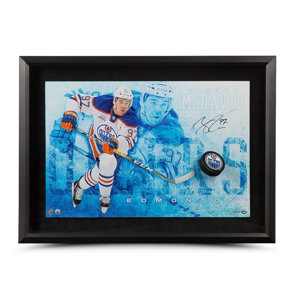 Connor McDavid Autographed 16x24 Oilers Break-Through Photo Upper Deck Authenticated: Connor McDavid Autographed 16x24 Oilers Break-Through Photo Upper Deck Authenticated Capture the essence of hockey greatness with this Connor McDavid autographed 16X24 Break-Through Puck Photo. Featur