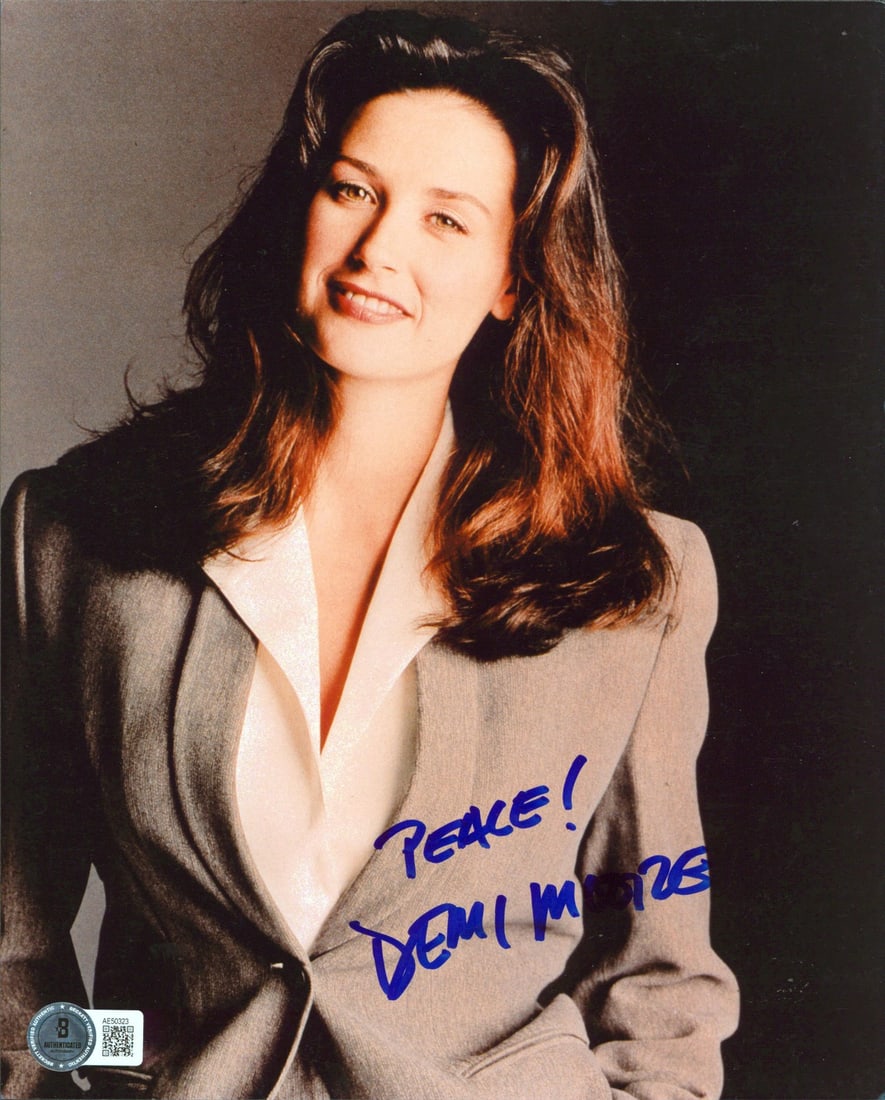 Demi Moore signed 8x10 photo Peace Beckett auto grade 10: Demi Moore signed 8x10 photo Peace Beckett auto grade 10 This 8x10 photograph features Demi Moore from the film "A Few Good Men" and includes her handwritten inscription "Peace!" The photo has been pe