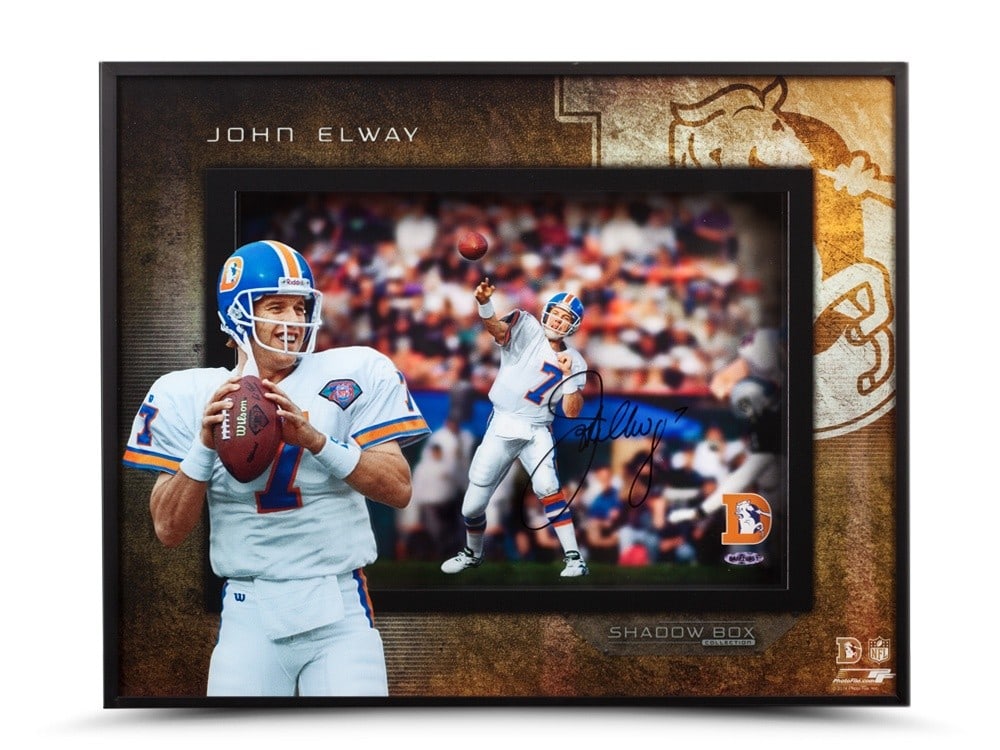 John Elway Autographed 16x20 Framed Photo Upper Deck Broncos: John Elway Autographed 16x20 Framed Photo Upper Deck Broncos Celebrate the legacy of NFL great John Elway with this stunning autographed 16X20 framed shadowbox photo. This original piece showcases Elw