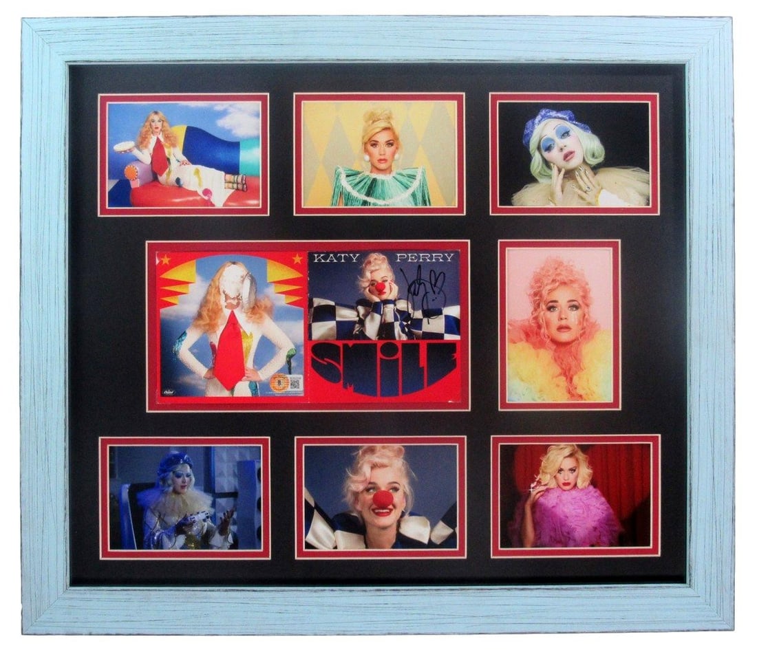 Katy Perry Signed Smile CD Insert Framed Beckett Authenticated: Katy Perry Signed Smile CD Insert Framed Beckett Authenticated Celebrate the music of Katy Perry with this beautifully framed signed "Smile" CD insert, accompanied by a stunning photo collage. This or