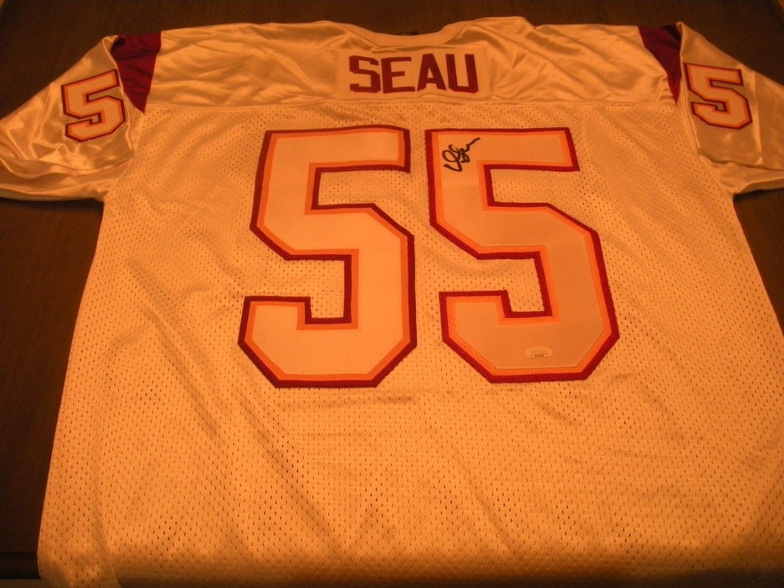 Nike Licensed Jersey Signed by Junior Seau with JSA COA: Nike Licensed Jersey Signed by Junior Seau with JSA COA This is an official licensed Nike football jersey, signed by Junior Seau. The jersey represents the USC Trojans and San Diego Chargers, and come