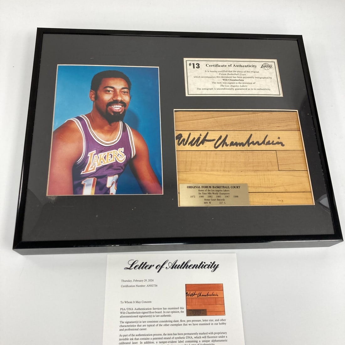 Wilt Chamberlain Signed Lakers Court Floor Piece with PSA COA: Wilt Chamberlain Signed Lakers Court Floor Piece with PSA COA This remarkable piece features a signed original fragment of the basketball court from the Forum, home to the legendary Los Angeles Lakers