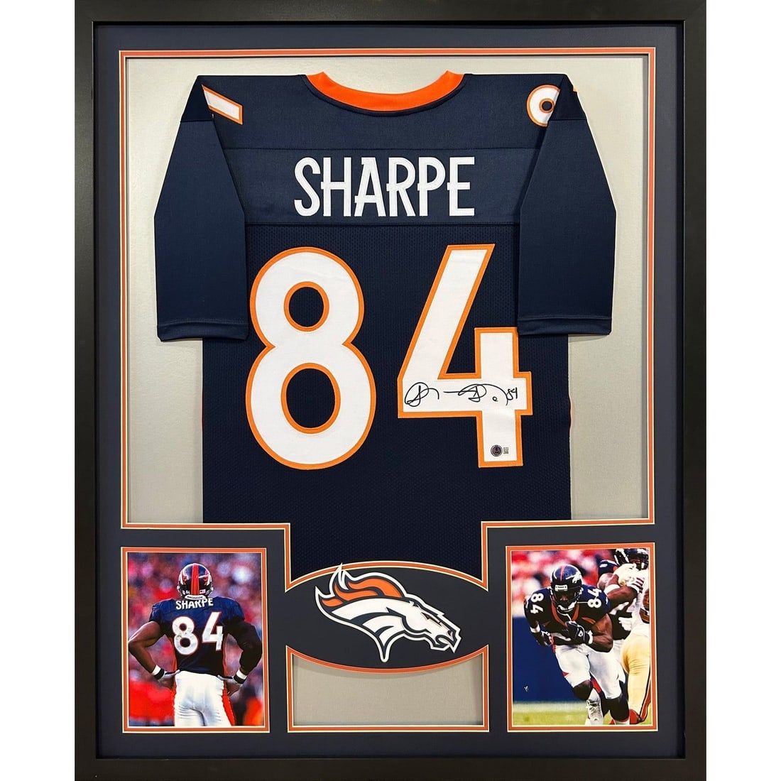 Shannon Sharpe Signed Framed Jersey Denver Broncos Beckett Authenticated: Shannon Sharpe Signed Framed Jersey Denver Broncos Beckett Authenticated This is an autographed Shannon Sharpe framed jersey, showcasing his iconic Denver Broncos colors. Authenticated by Beckett, a l
