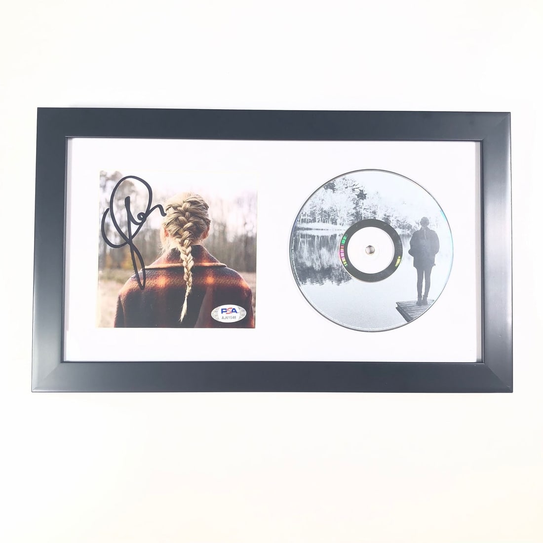 Taylor Swift Evermore Signed Framed CD Cover PSA/DNA Authenticated: Taylor Swift Evermore Signed Framed CD Cover PSA/DNA Authenticated This framed CD album cover features a signature from Taylor Swift, celebrating her album 'Evermore'. The autograph has been authentic