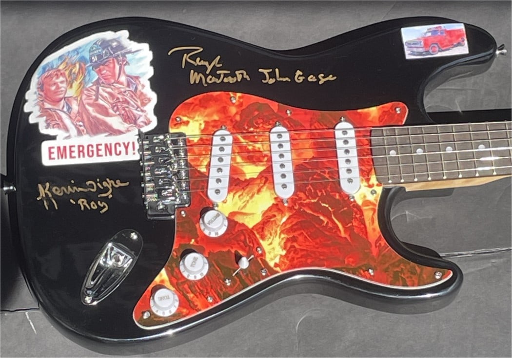 Randolph Mantooth Kevin Tighe Signed Custom Guitar Emergency Beckett Authenticated: Randolph Mantooth Kevin Tighe Signed Custom Guitar Emergency Beckett Authenticated This is a custom guitar signed by Randolph Mantooth and Kevin Tighe, featuring their authentic signatures. The guitar
