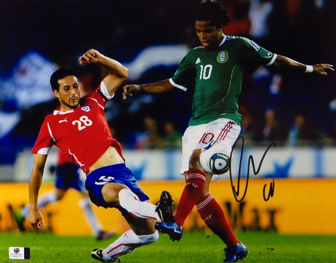Giovani dos Santos Autographed 11x14 Photo LA Galaxy Certified GAI: Giovani dos Santos Autographed 11x14 Photo LA Galaxy Certified GAI This striking 11X14 photo features Giovani dos Santos, the talented Mexican soccer player known for his time with the LA Galaxy. The 