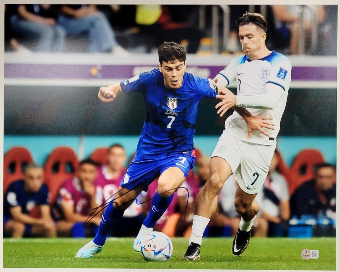 Giovanni Reyna Signed 16x20 USMNT Photo Autographed Beckett BAS: Giovanni Reyna Signed 16x20 USMNT Photo Autographed Beckett BAS This is an original 16x20 photo of Giovanni Gio Reyna, featuring his autograph. The item is authenticated by Beckett Authentication Serv