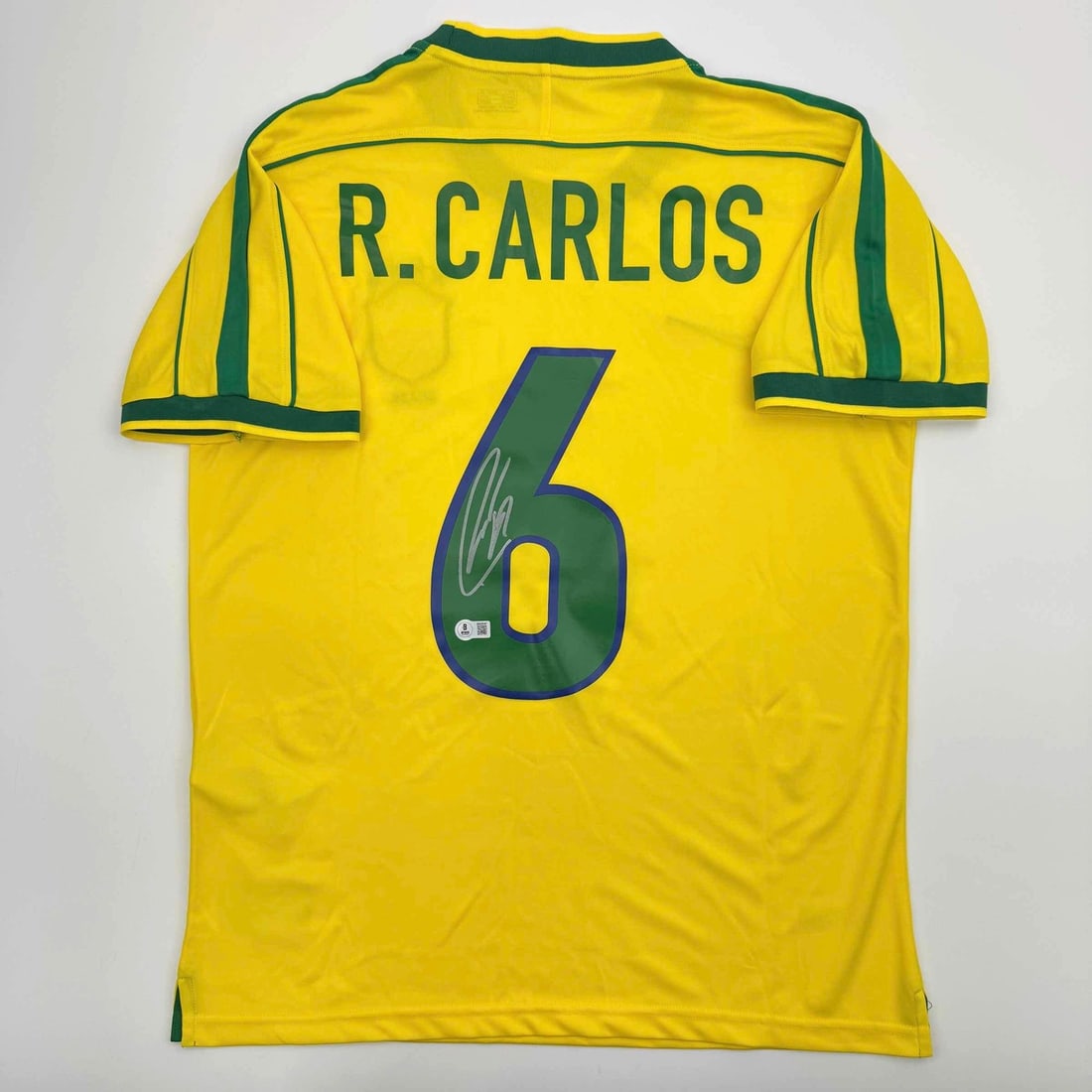 Roberto Carlos Autographed Brazil Yellow Soccer Jersey Beckett COA: Roberto Carlos Autographed Brazil Yellow Soccer Jersey Beckett COA Celebrate the legacy of soccer legend Roberto Carlos with this authentic, autographed Brazil yellow soccer jersey. This original jers