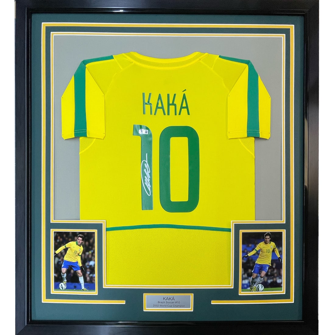 Framed Signed Ricardo Kaka Brazil Jersey with BAS COA: Framed Signed Ricardo Kaka Brazil Jersey with BAS COA This is a framed, autographed Ricardo Kaka Brazilian yellow soccer jersey, measuring 33x42 inches, professionally framed and matted. The display i