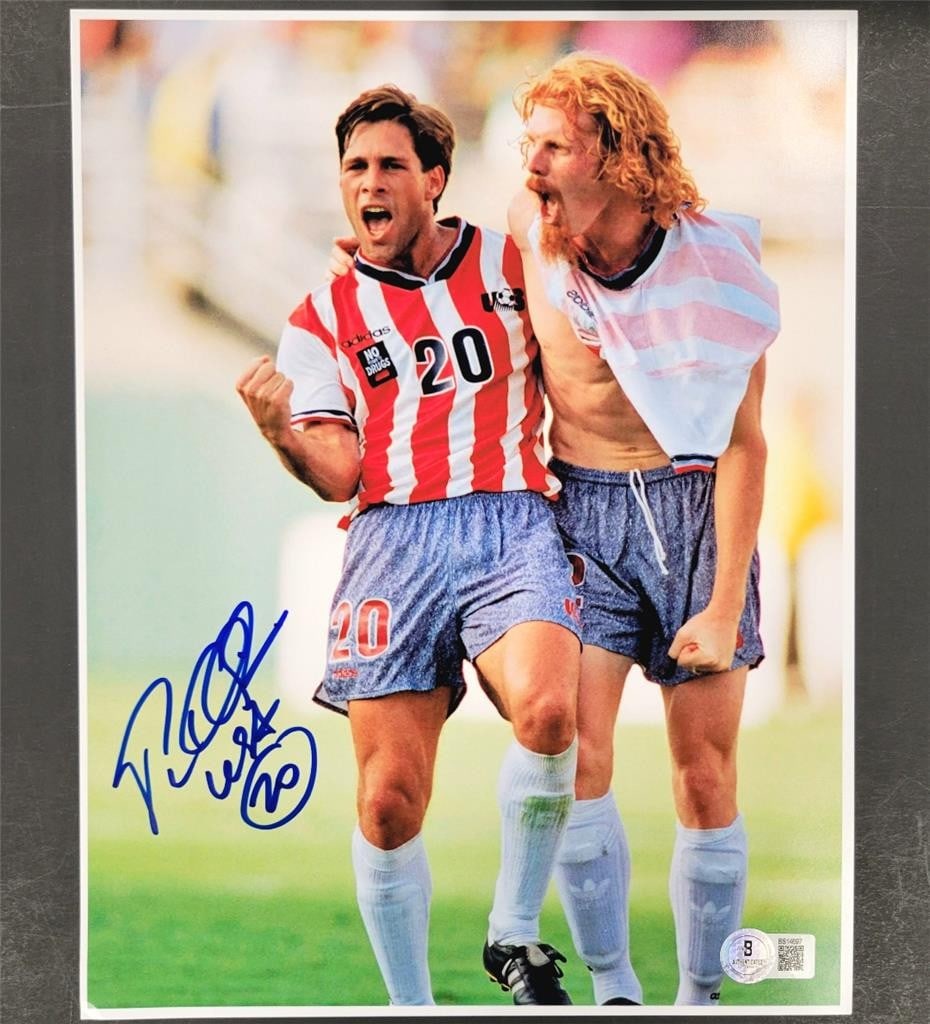 Paul Caligiuri Signed USA 1994 World Cup Photo with Beckett Authentication: Paul Caligiuri Signed USA 1994 World Cup Photo with Beckett Authentication This is an original 8.5x11 photo signed by Paul Caligiuri, celebrated for his contributions to the USA soccer team during the