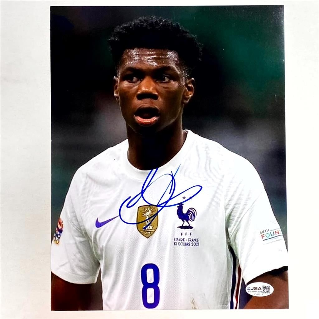 8.5x11 Soccer Photograph Signed by Aurelien Tchouameni Beckett Authenticated: 8.5x11 Soccer Photograph Signed by Aurelien Tchouameni Beckett Authenticated This 8.5x11 photo features the autograph of Aurelien Tchouameni, the professional soccer player for Real Madrid and France.