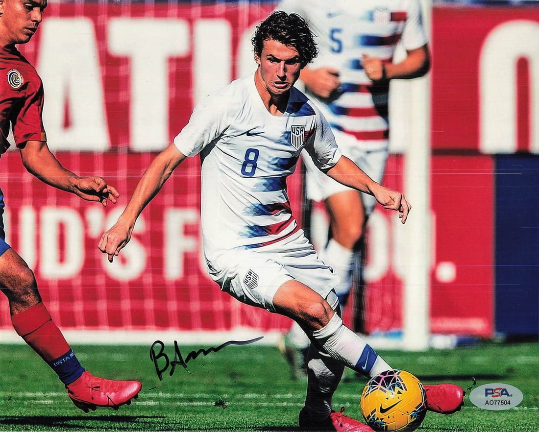 Brenden Aaronson Signed 8x10 Photo PSA/DNA Team USA Autograph: Brenden Aaronson Signed 8x10 Photo PSA/DNA Team USA Autograph This is an 8x10 photograph signed by Brenden Aaronson, a prominent player for Team USA. The autograph has been authenticated by PSA/DNA Au
