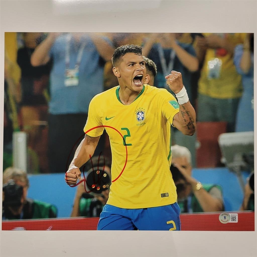 Thiago Silva Signed Brazil 11x14 Photo Beckett BAS Certified: Thiago Silva Signed Brazil 11x14 Photo Beckett BAS Certified This is an original signed photo of Thiago Silva, showcasing his affiliation with the Brazil national soccer team. The photo is authenticat