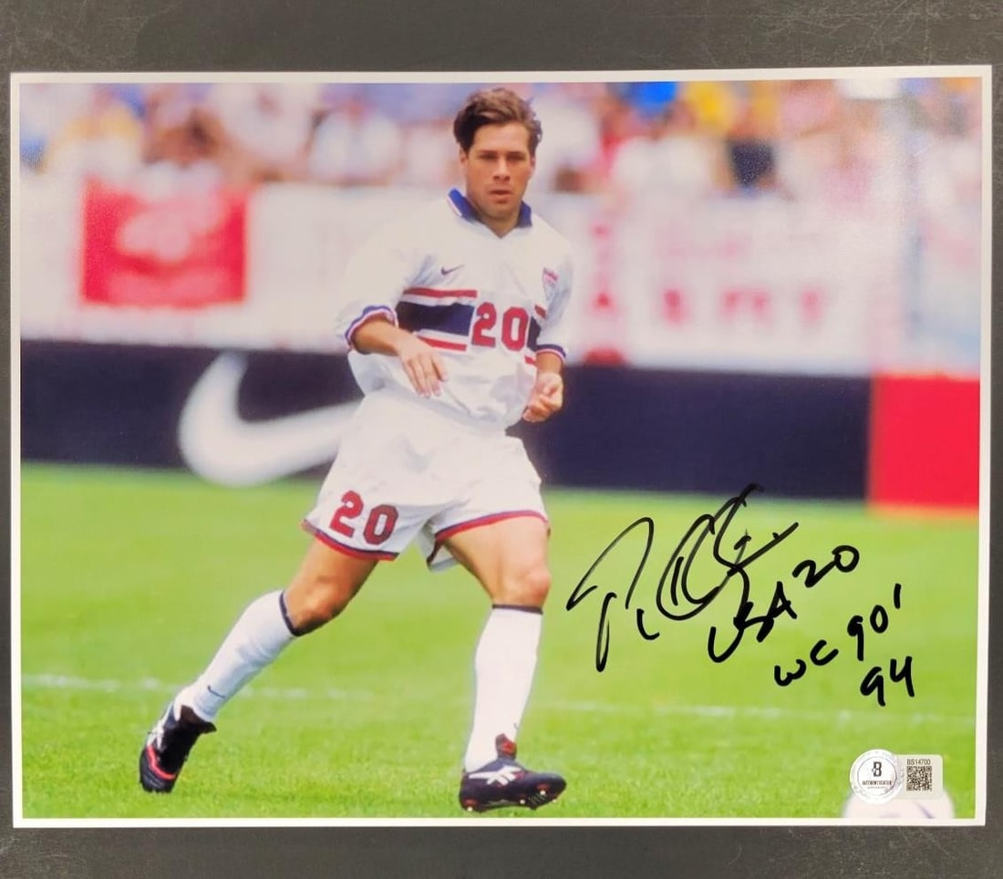 Paul Caligiuri Autographed USA 90 94 WC Photo Beckett BAS: Paul Caligiuri Autographed USA 90 94 WC Photo Beckett BAS This is an original signed photograph of Paul Caligiuri, a notable player for the USA soccer team, featuring his autograph. The photo measures