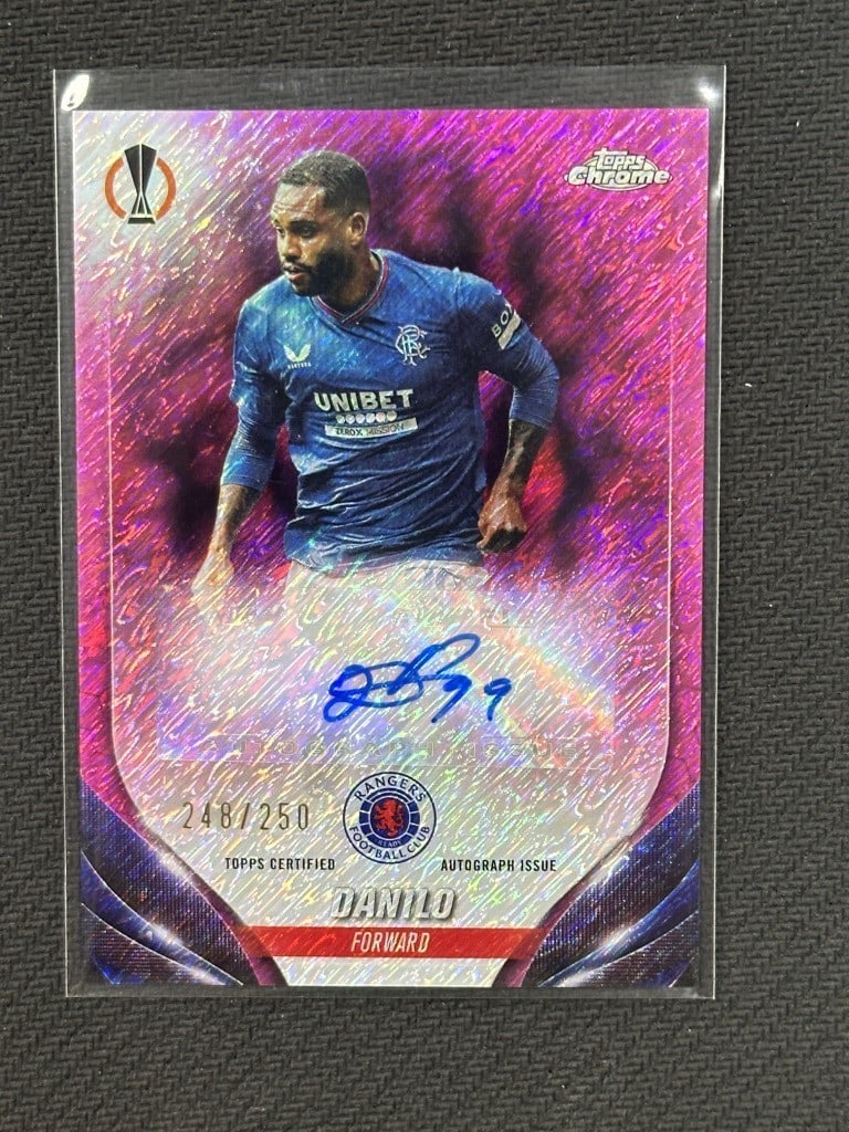 Danilo 2023-24 Topps Chrome Fuschia Shimmer Auto QPR Limited Edition #CA-D: Danilo 2023-24 Topps Chrome Fuschia Shimmer Auto QPR Limited Edition #CA-D This is a 2023-24 Topps Chrome Fuschia Shimmer Autograph soccer card featuring player Danilo, representing Queens Park Ranger