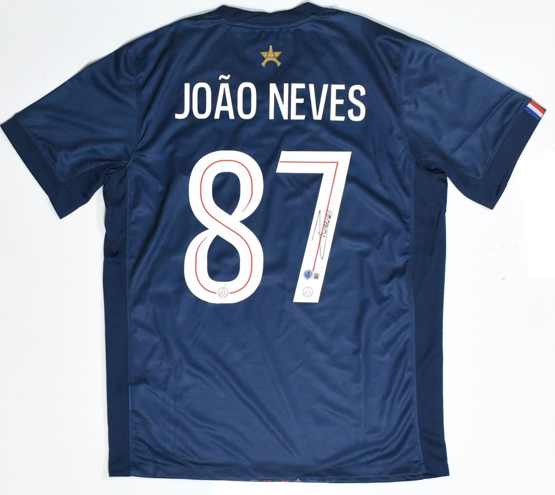 PSG Home Jersey Autographed by Joao Neves Beckett Holo #87: PSG Home Jersey Autographed by Joao Neves Beckett Holo #87 This PSG home soccer jersey features the autograph of Joao Neves and displays his number 87. The jersey is an original team item and is in pr