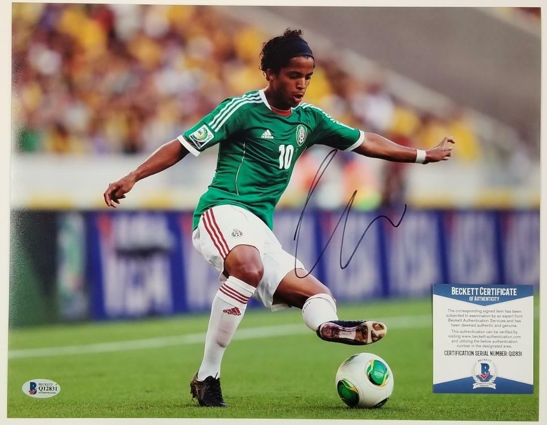 11x14 Mexico Soccer Photo Signed by Giovani Dos Santos Beckett BAS Authenticated: 11x14 Mexico Soccer Photo Signed by Giovani Dos Santos Beckett BAS Authenticated This is an original 11x14 photo featuring Giovani Dos Santos, signed and authenticated by Beckett. The photo showcases 