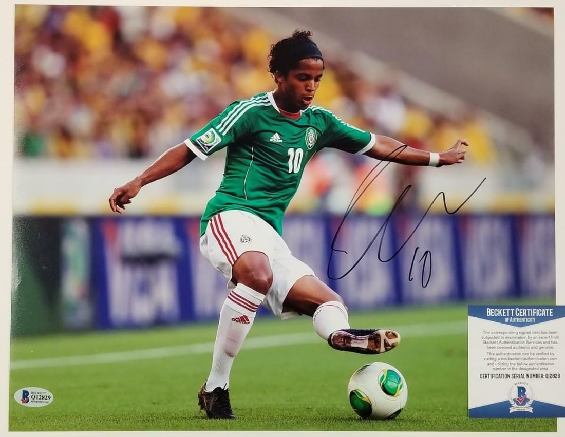 Giovani Dos Santos Mexico Soccer 11x14 Signed Photo Beckett Authenticated: Giovani Dos Santos Mexico Soccer 11x14 Signed Photo Beckett Authenticated This is an original 11x14 photograph signed by Giovani Dos Santos, featuring his autograph with authentication by Beckett. The
