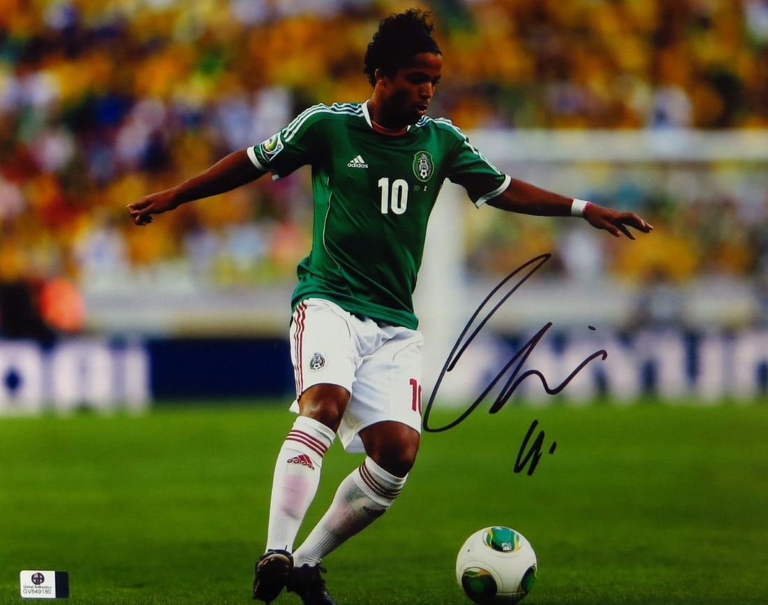 Giovani dos Santos LA Galaxy Signed 11x14 Photo GAI Authenticated: Giovani dos Santos LA Galaxy Signed 11x14 Photo GAI Authenticated This is an original 11X14 photo of Giovani dos Santos, the talented soccer player. It features his autograph authenticated by Global A