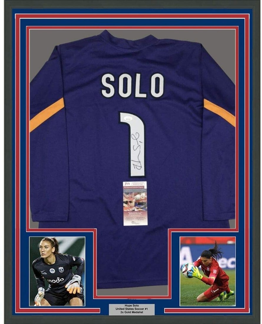 Framed Hope Solo Signed 35x39 Purple USA World Cup Jersey JSA COA: Framed Hope Solo Signed 35x39 Purple USA World Cup Jersey JSA COA This professionally framed and matted jersey features the autograph of Hope Solo, the renowned goalkeeper of the United States Women's