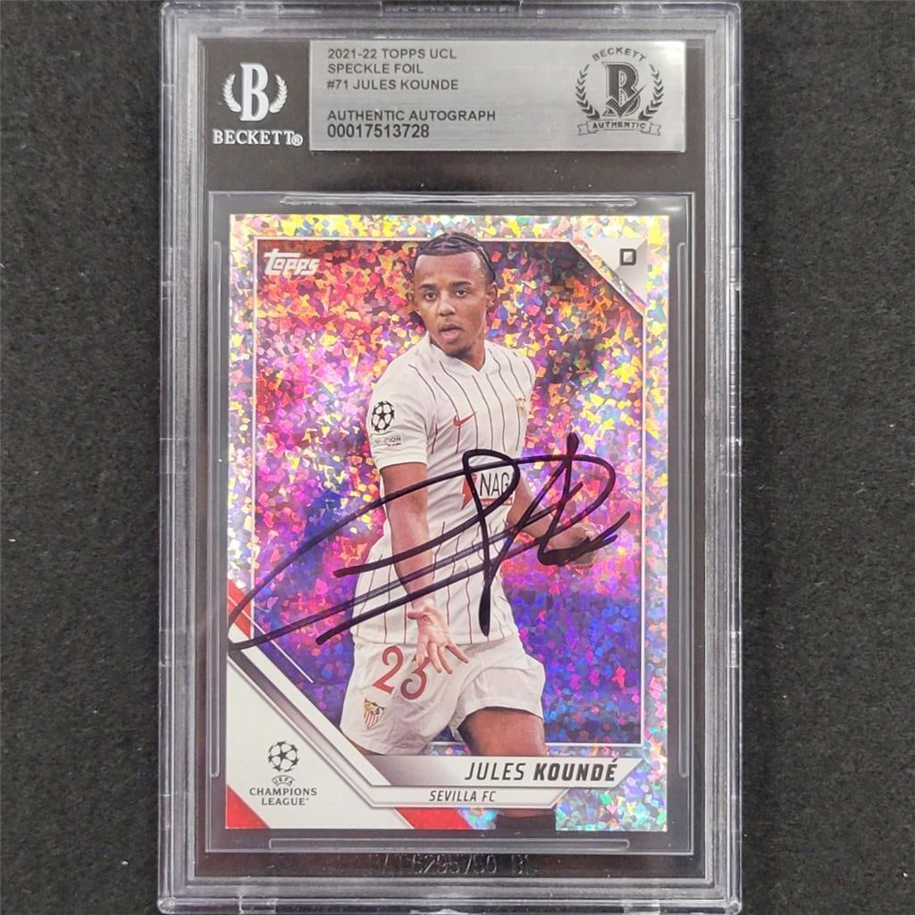 Jules Kounde Signed 2021-22 Topps UCL Speckle Foil Card Beckett BAS Authenticated: Jules Kounde Signed 2021-22 Topps UCL Speckle Foil Card Beckett BAS Authenticated This is a 2021-22 Topps UCL Speckle Foil #71 soccer trading card featuring Jules Kounde. The card is hard signed with 