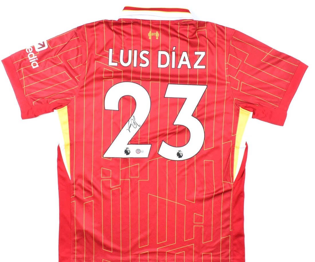 Liverpool Home Red Jersey Signed by Luis Diaz Beckett Authenticated: Liverpool Home Red Jersey Signed by Luis Diaz Beckett Authenticated This is a pre-owned Liverpool FC home red soccer jersey, signed by player Luis Diaz with the number 23. The jersey includes a Becket