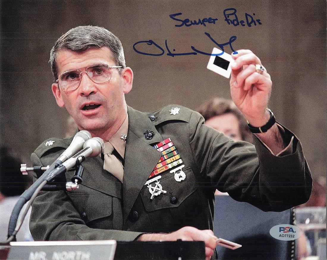 Oliver North PSA/DNA Authenticated 8x10 Signed Photograph: Oliver North PSA/DNA Authenticated 8x10 Signed Photograph This is a professionally printed 8x10 photograph autographed by Oliver North. The signature has been authenticated by PSA/DNA, ensuring its au