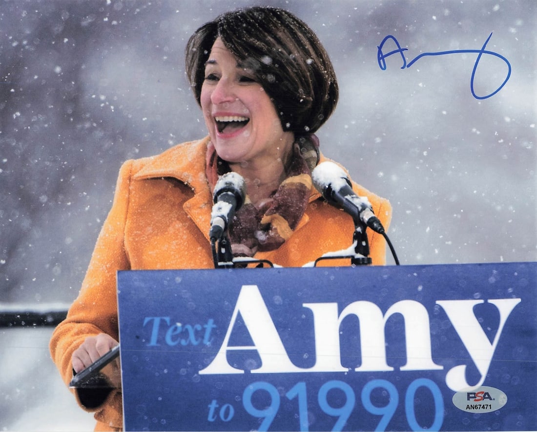 Amy Klobuchar Signed 8x10 Photo PSA/DNA Authenticated Political Collectible: Amy Klobuchar Signed 8x10 Photo PSA/DNA Authenticated Political Collectible This is an original 8x10 photograph featuring a signature from politician Amy Klobuchar. The autograph has been verified by 