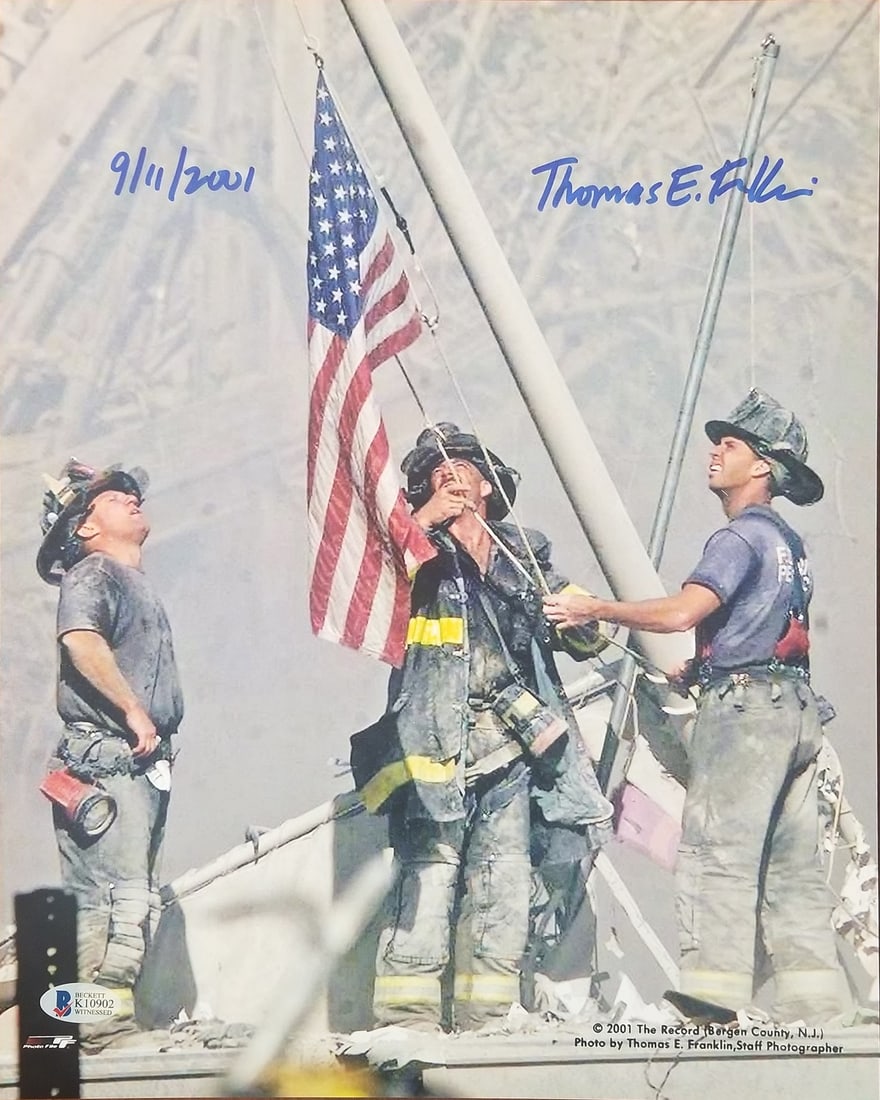 Thomas E. Franklin Signed 11x14 9/11 Firefighters Photo BAS COA: Thomas E. Franklin Signed 11x14 9/11 Firefighters Photo BAS COA This striking 11x14 photograph captures the iconic moment of three firefighters raising the American flag at Ground Zero on 9/11, person