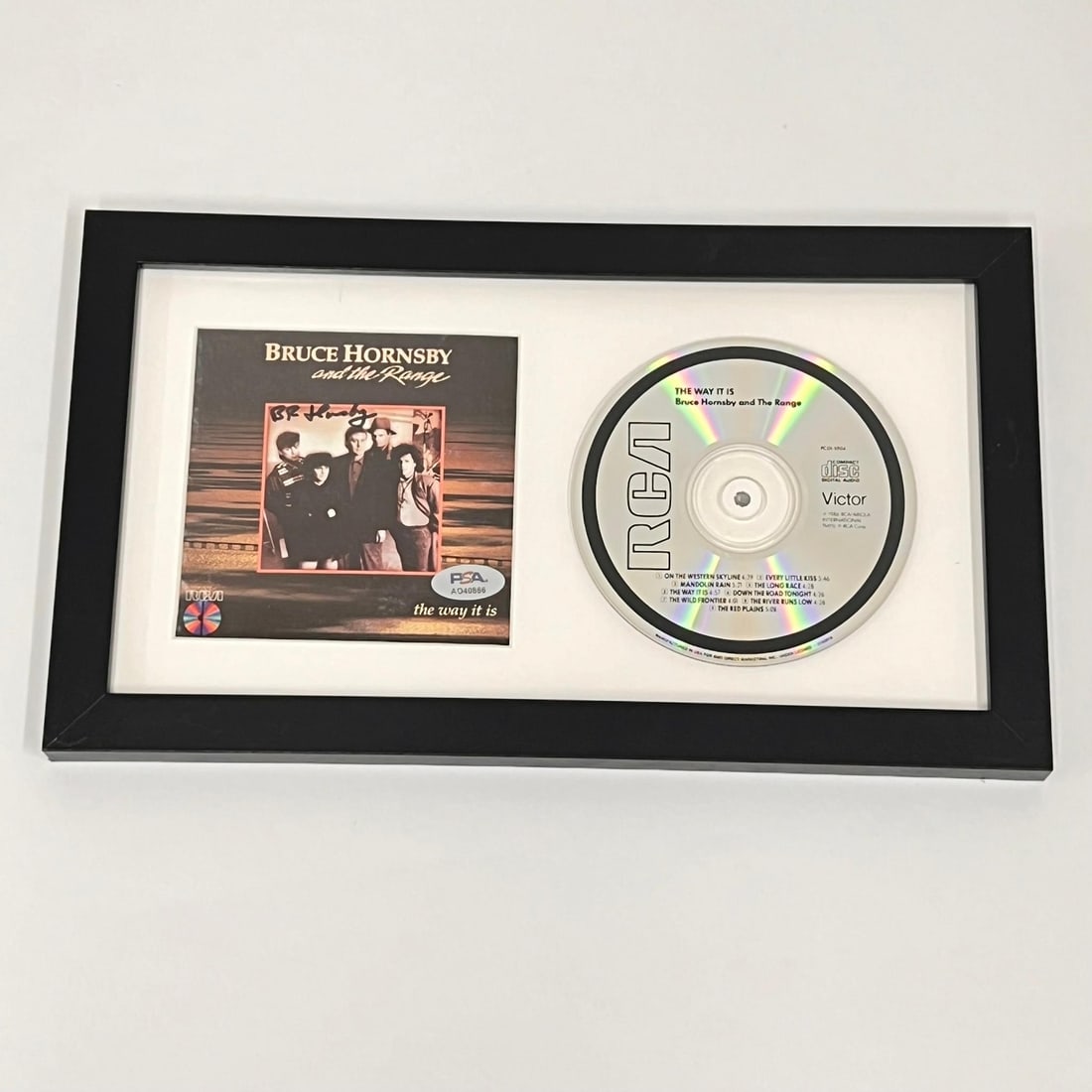 Bruce Hornsby Signed The Way It Is Framed Album Cover PSA/DNA: Bruce Hornsby Signed The Way It Is Framed Album Cover PSA/DNA Enhance your collection with this framed CD album cover of Bruce Hornsby's acclaimed 'The Way It Is,' complete with his authentic signatur