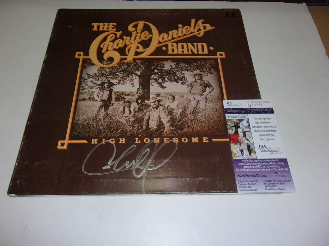 Signed Charlie Daniels High Lonesome Album Cover With JSA COA: Signed Charlie Daniels High Lonesome Album Cover With JSA COA This is an original LP record album cover for "High Lonesome" signed by Charlie Daniels. The item is pre-owned and originates from the Uni