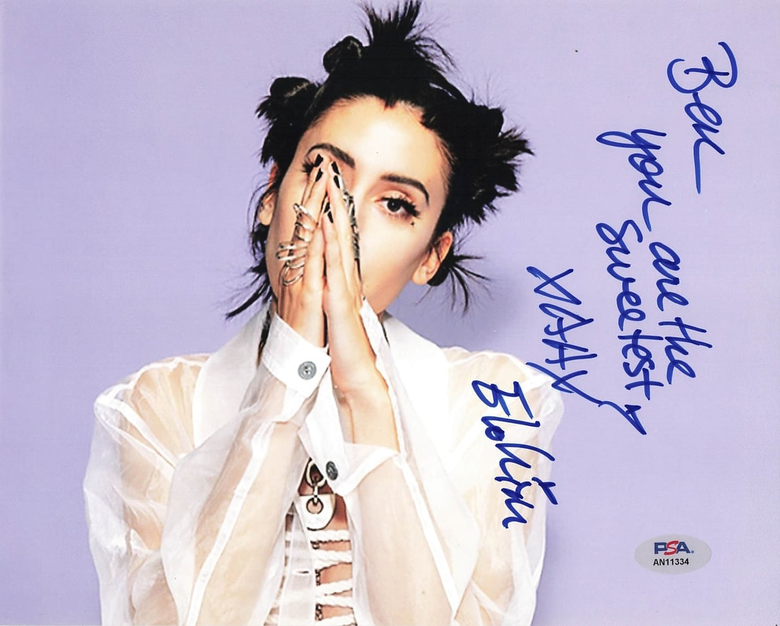Autographed Elohim 8x10 Inch Photo With PSA/DNA Authentication: Autographed Elohim 8x10 Inch Photo With PSA/DNA Authentication This is a professionally printed 8x10 photograph signed by Elohim. The autograph has been authenticated by PSA/DNA. The photo is in pre-o