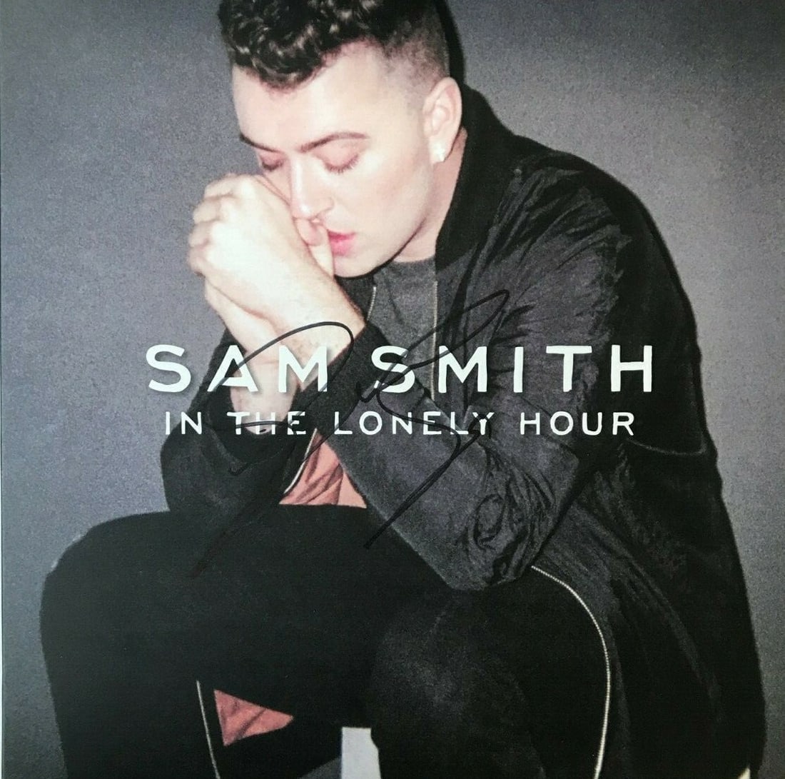 Sam Smith Autographed In The Lonely Hour Vinyl Album: Sam Smith Autographed In The Lonely Hour Vinyl Album This is an original autographed album of "In The Lonely Hour" by Pop Star Sam Smith. The album cover is signed by Sam Smith in black ink. It was si