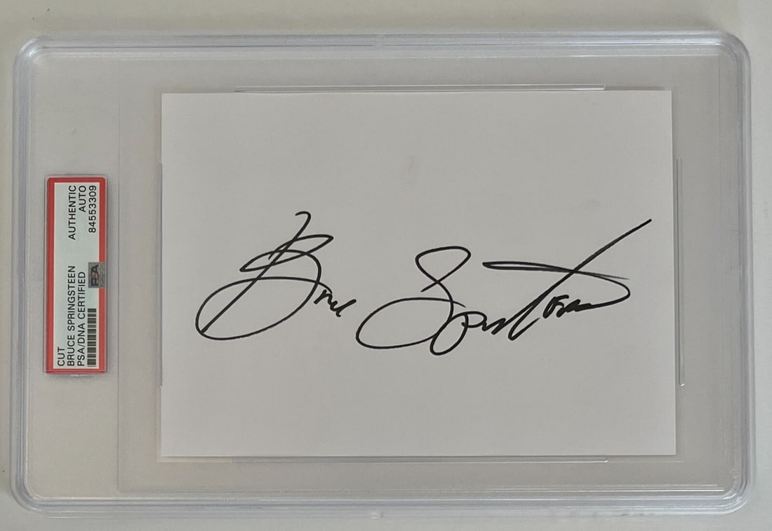 Bruce Springsteen Bold Cut Signature PSA/DNA Authenticated 7x11: Bruce Springsteen Bold Cut Signature PSA/DNA Authenticated 7x11 This is an original cut signature of rock legend Bruce Springsteen, featuring a gigantic and bold autograph measuring 7" x 11" including