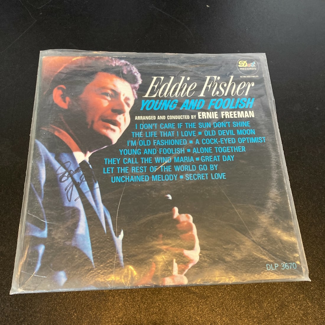 Eddie Fisher Signed Vintage LP Record Young and Foolish Guaranteed Authentic: Eddie Fisher Signed Vintage LP Record Young and Foolish Guaranteed Authentic This vintage LP record features an authentic signature from Eddie Fisher, a renowned entertainer. This autographed item is 